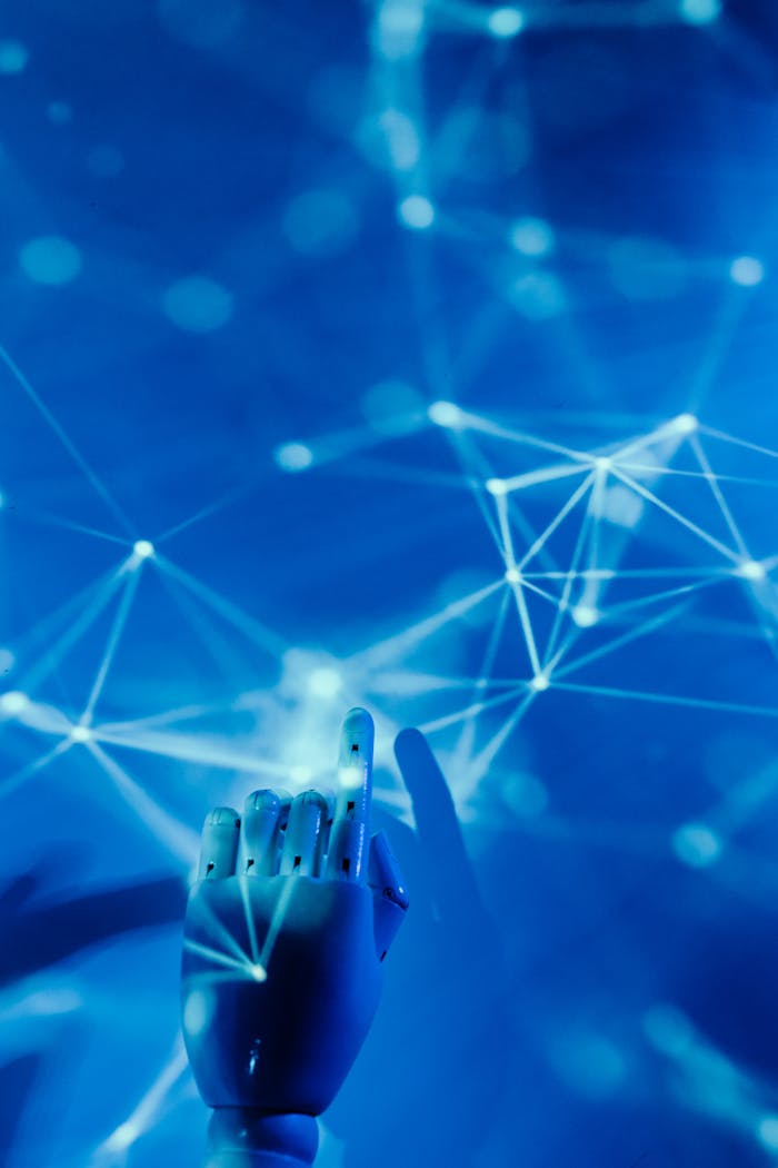 gallery-04 Futuristic robotic hand touching a digital network on a blue background.